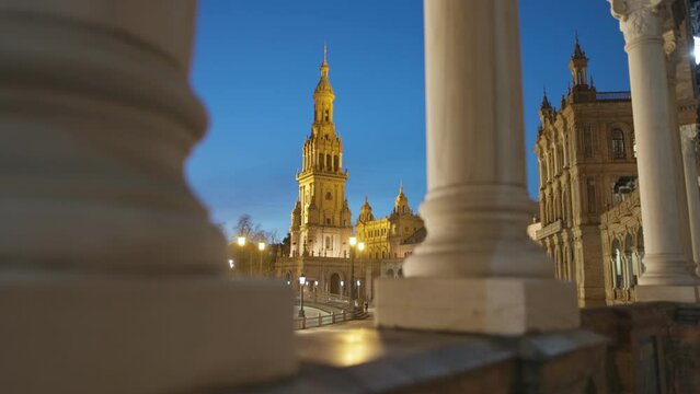 Camera moves through columns in Plaza de Espana - Spanish Square- , Sevilla, Spain. Night view of Plaza de Espana complex. Gimbal high quality shot, 4K