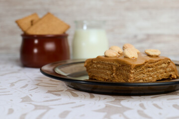 Sweet milk cake on white background with milk and cookies