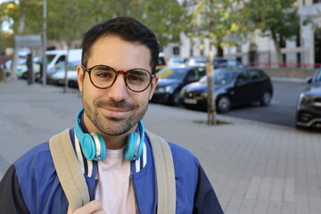 Young adult student walking outdoors