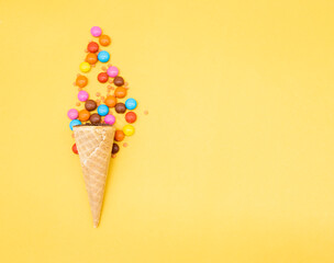 crispy candy over on yellow background