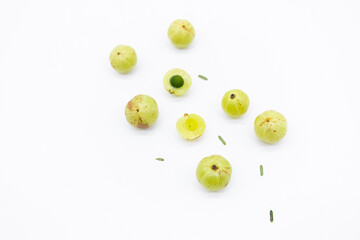 gooseberry fruits or Amalaki slice in a row isolated on white background. top view