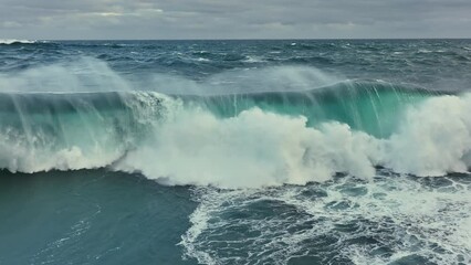 Big storm sea of ocean surf. Pacific Ocean wave crashing. Aerial slow motion shot