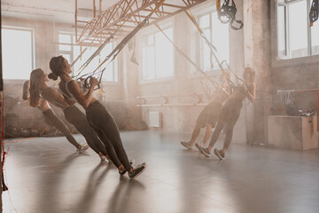 Shot of fitness group having workout session at gym