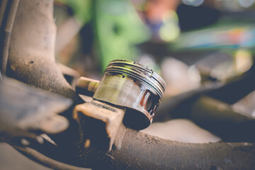 Damaged motorcycle engine piston rings from use.
