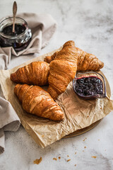 Top view of croissant and currant jam