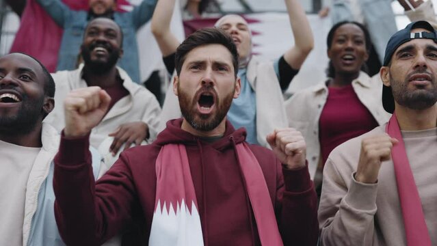 Bearded man cheering favorite team during soccer game