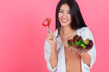 asian woman eating healthy fresh vegetable with copy space, Beauty healthcare diet and vegetarian lifestyle concept.