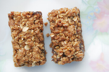 date fruit chocolate bar in a plate on table 