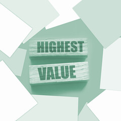Highest values words on wooden building blocks isolated on yellow. Social, business and education...