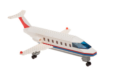 Close up of plastic toy passenger airplane, isolated