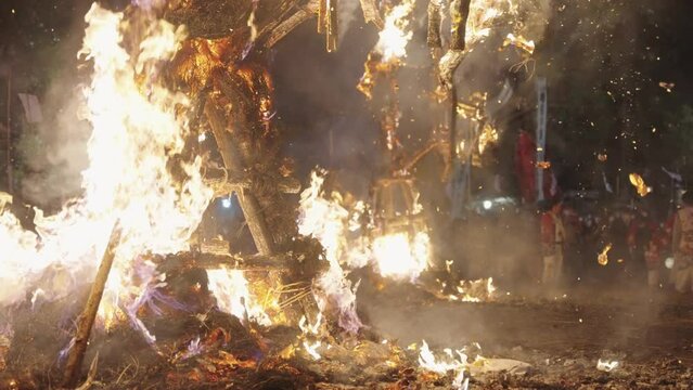 Close up of Burning Sagicho Float Bonfire at Night, Slow motion 4k