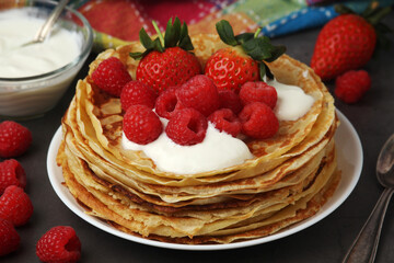Russian cuisine national dish bliny with fresh berries	