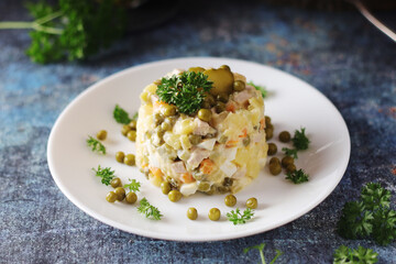Olivier salad, traditional Russian dish, served on the plate