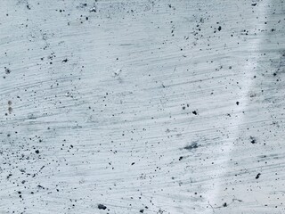 an irregular whitewashed gray wall