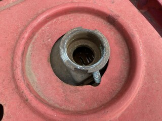 Close up old radiator cap under the hood of the car