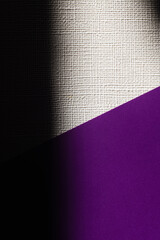 white and purple textured background with black shadow.