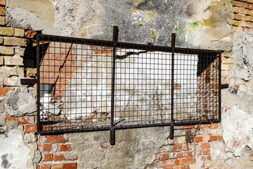 Old industrial building ruin with damaged brick wall