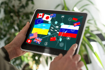 country flags and Ukrainian and Russian flag on the tablet