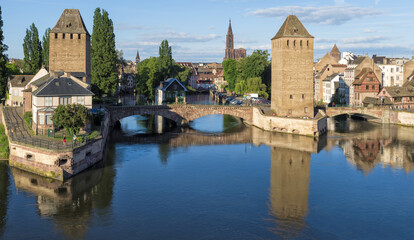Fototapeta na wymiar Strasbourg, France - May 21, 2017: .Covered bridge over ILL Canal, Strasbourg, Alsace, Bas-Rhin Department, France