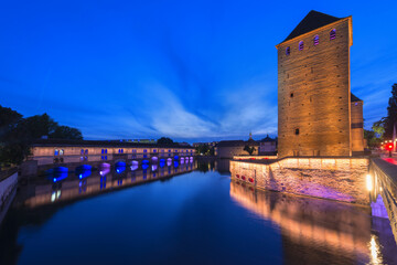 Covered bridge and Vauban dam over ILL Canal at sunset, Strasbourg, Alsace, Bas-Rhin Department,...