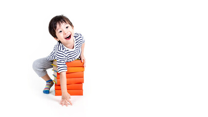 little boy wearing glasses with books on white background, education concept.