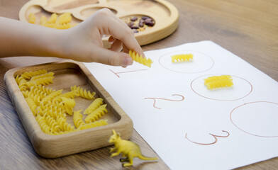 Game for kids to develop fine motor skills.Concept early development, natural toys, fine motor...