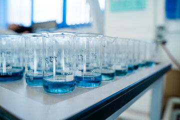 Laboratory for analysis of flasks with blue liquid a lot