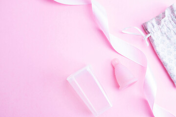 Menstrual cycle sanitary cup. Pink ribbon with menstrual cup. Menstruation feminine period. Sanitary hygiene banner. Use menstrual cup inside vagina.