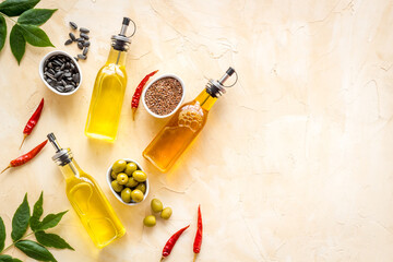 Cooking oil in bottles. Sunflower olive and sesame oil with ingredients
