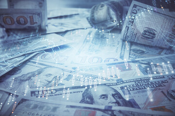 Multi exposure of forex chart drawing over us dollars bill background. Concept of financial success markets.