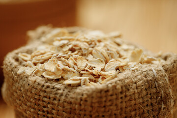 Оatmeal in bowls and bags on a wooden background. High quality photo