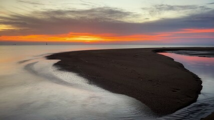 Fototapeta na wymiar sunset on the beach in long exposure