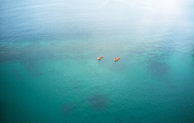 Exploring the beauty of the ocean one paddle at a time. High angle shot of two adventurous young...