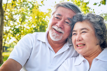 Happy asian elderly couple relax in park,  relationship retirement, People lifestyle concept.