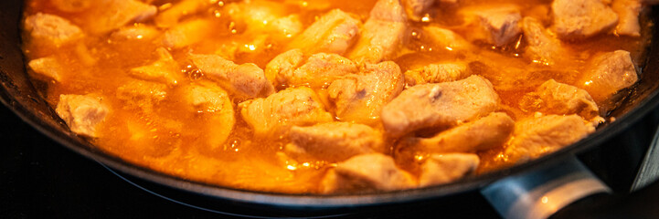 chicken meat in tomato sauce curry in frying pan cook meal fresh poultry meat portion healthy meal food diet snack on the table copy space food background rustic top view