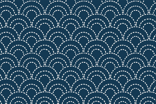 Seigaiha Japanese sashiko seamless pattern with white scallop stitches on dark navy background symbolizing waves of blue sea. 