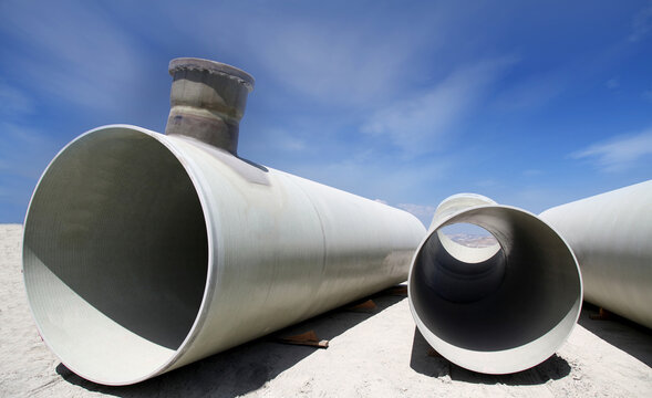 Stack of new metal pipes. Industrial material.