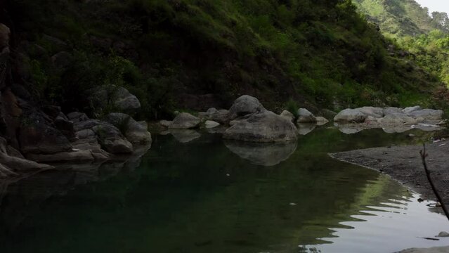 Close aerial shot of mountains with river 