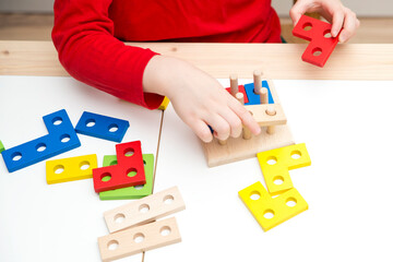 Matching the shapes. 3D wooden constructor. Implement for learning to count. Addition and subtraction exercises. Montessori methodology for nursery and preschool children.