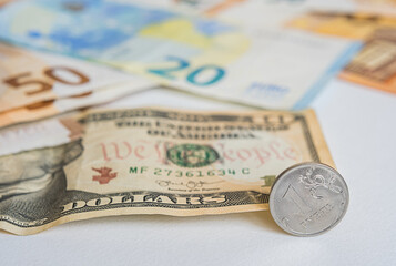 coin one ruble, European and dollars currency: banknotes of fifty, twenty euro coins