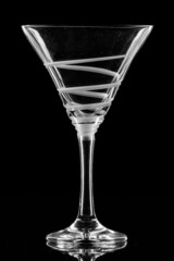  A cocktail glass in a black background