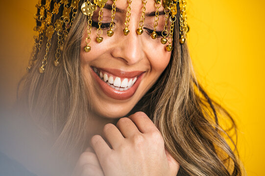 Charming woman wearing tassel headband in studio