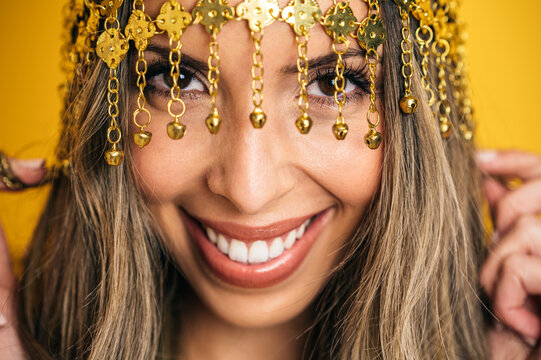 Charming woman wearing tassel headband in studio