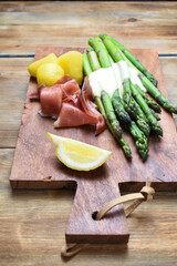 Green asparagus with Parma ham with sauce hollandaise