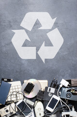 Old electronic devices on a dark background. The concept of recycling and disposal of electronic...