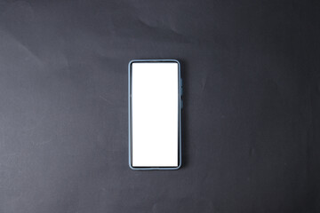 The phone is isolated on a black background. A smartphone with a white screen