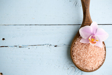 Spa scene on wooden background with orchids.