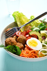 vegetables bowl with falafel and egg
