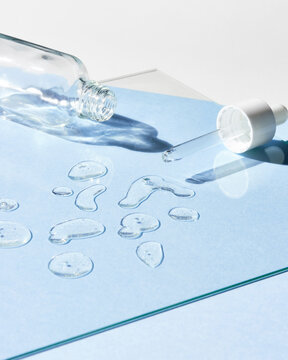 Empty Hyaluronic acid bottle on glass