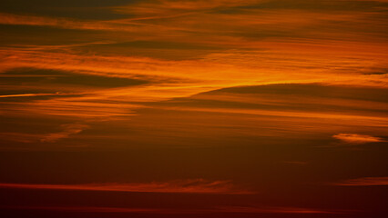 orange and golden sky with great lines in the horizon